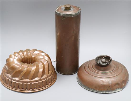 A 19th century copper jelly mould and two copper hot water bottles